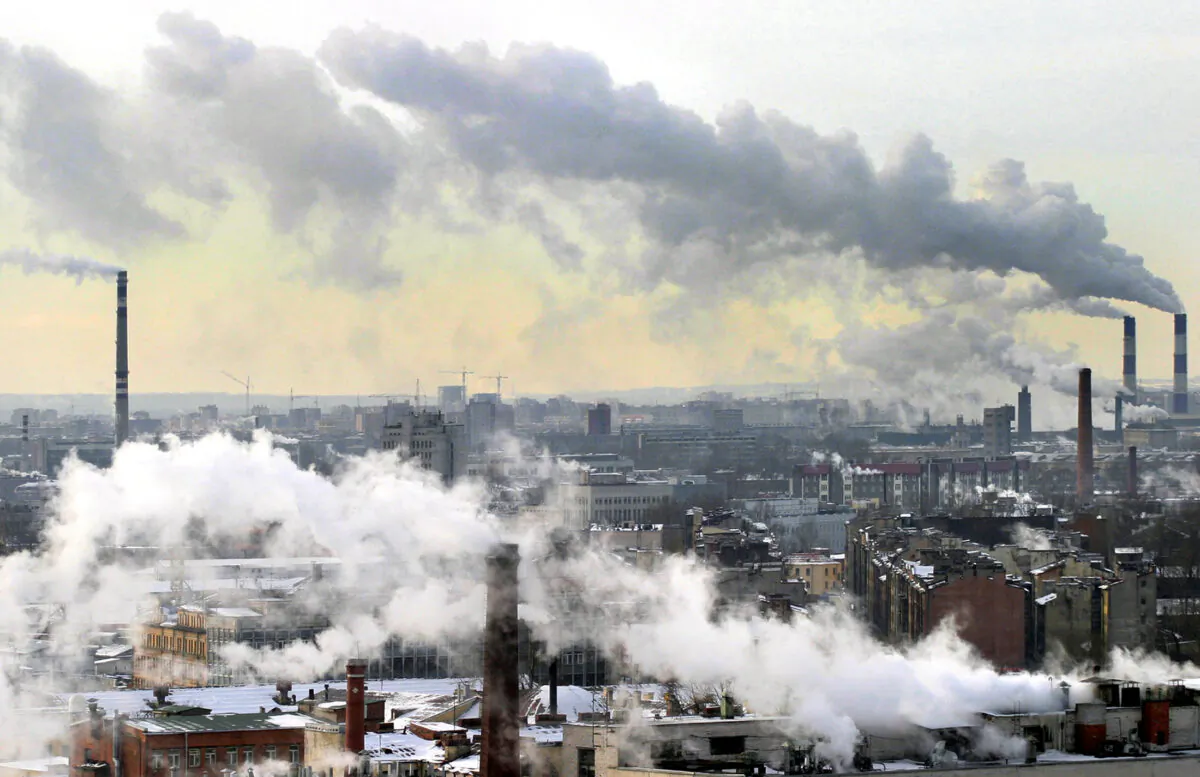 Smoke from the chimneys billow over St. Petersburg, on March 3, 2005. (Sergey Kulikov/AFP via Getty Images)