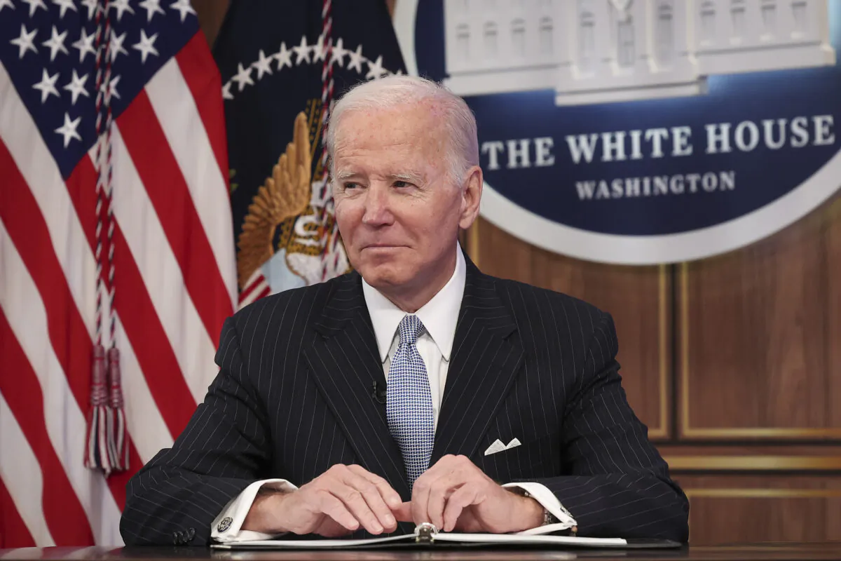 President Joe Biden looks toward reporters as they shout questions during an event in Washington on Nov. 18, 2022. (Win McNamee/Getty Images)