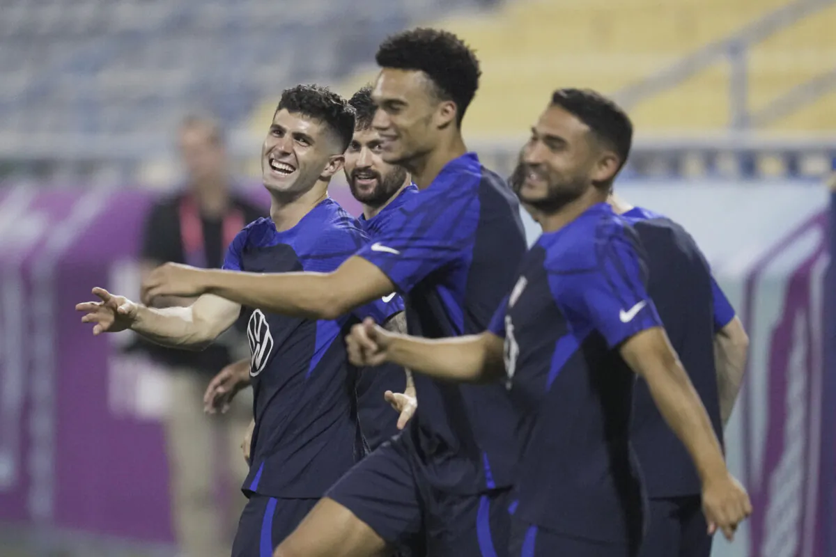 U.S. forward Christian Pulisic (L) and other players participate in an official training session at Al-Gharafa SC Stadium, in Doha, Qatar, on Nov. 19, 2022. (Ashley Landis/AP Photo)