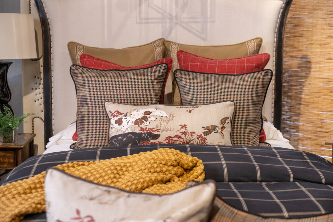 Black and white windowpane plaid adorn a new traditional bedscape. (Provided photo/TNS)