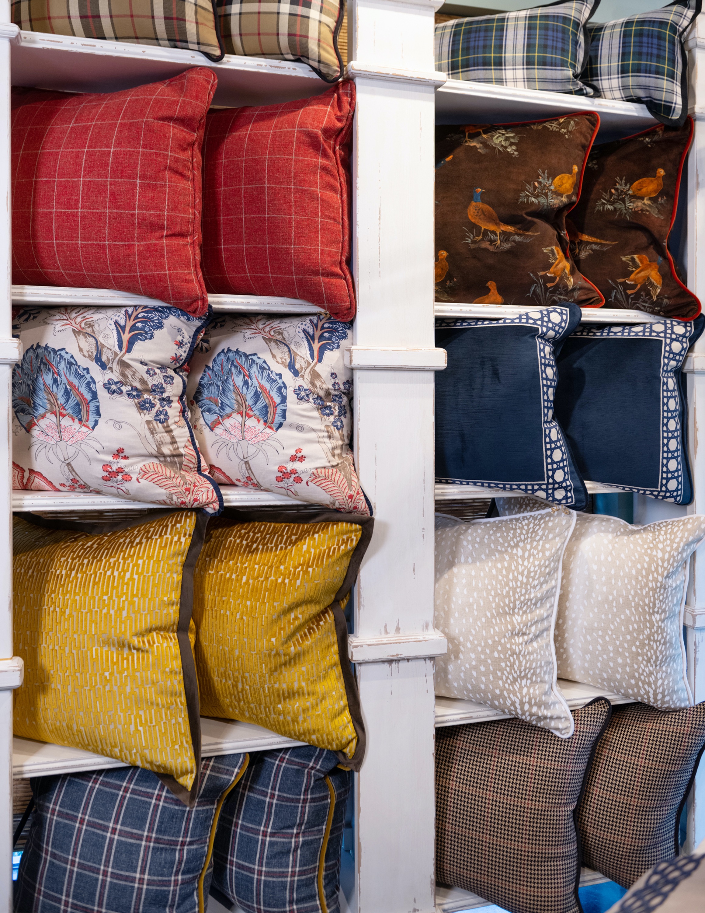 Windowpane, tartan and checkerboard plaids are on full display in this beautiful pillow wall.