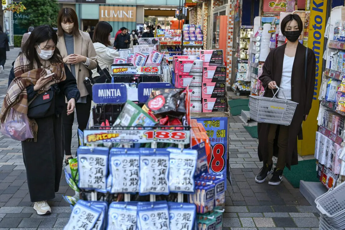 People shop at a drugstore chain store in downtown Tokyo, Japan, on Nov. 18, 2022. (Richard A. Brooks/AFP via Getty Images)