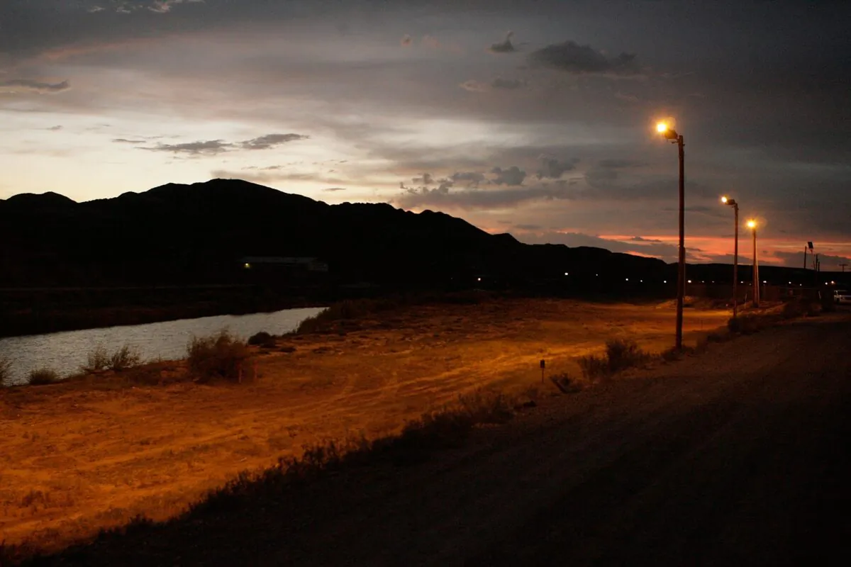 Bright lights illuminate the northern banks of the Rio Grande, the official border between the United States and Mexico, in El Paso, Texas, on June 30, 2007. (Chip Somodevilla/Getty Images)