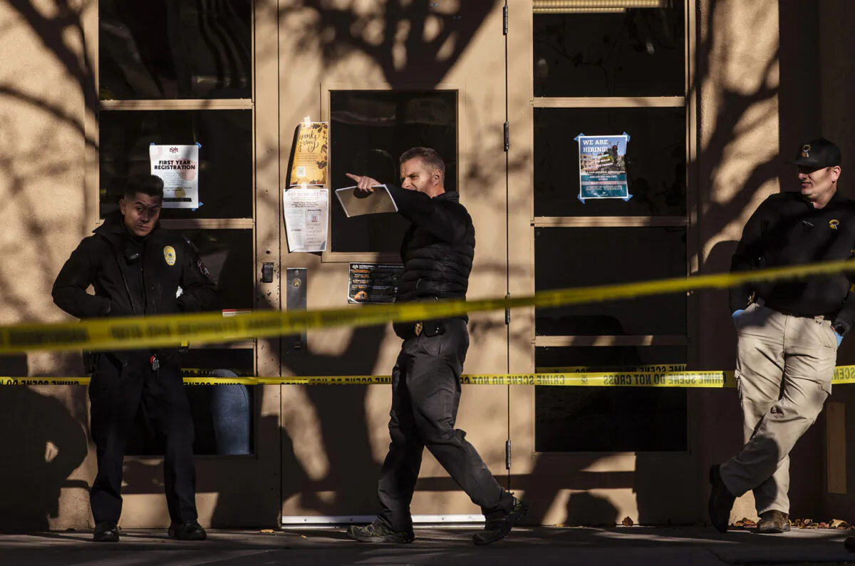 Law enforcement continue their investigation of a deadly overnight shooting at Coronado Hall on the campus of the University of New Mexico in Albuquerque, N.M., on Nov. 19, 2022. (Chancey Bush/The Albuquerque Journal via AP)