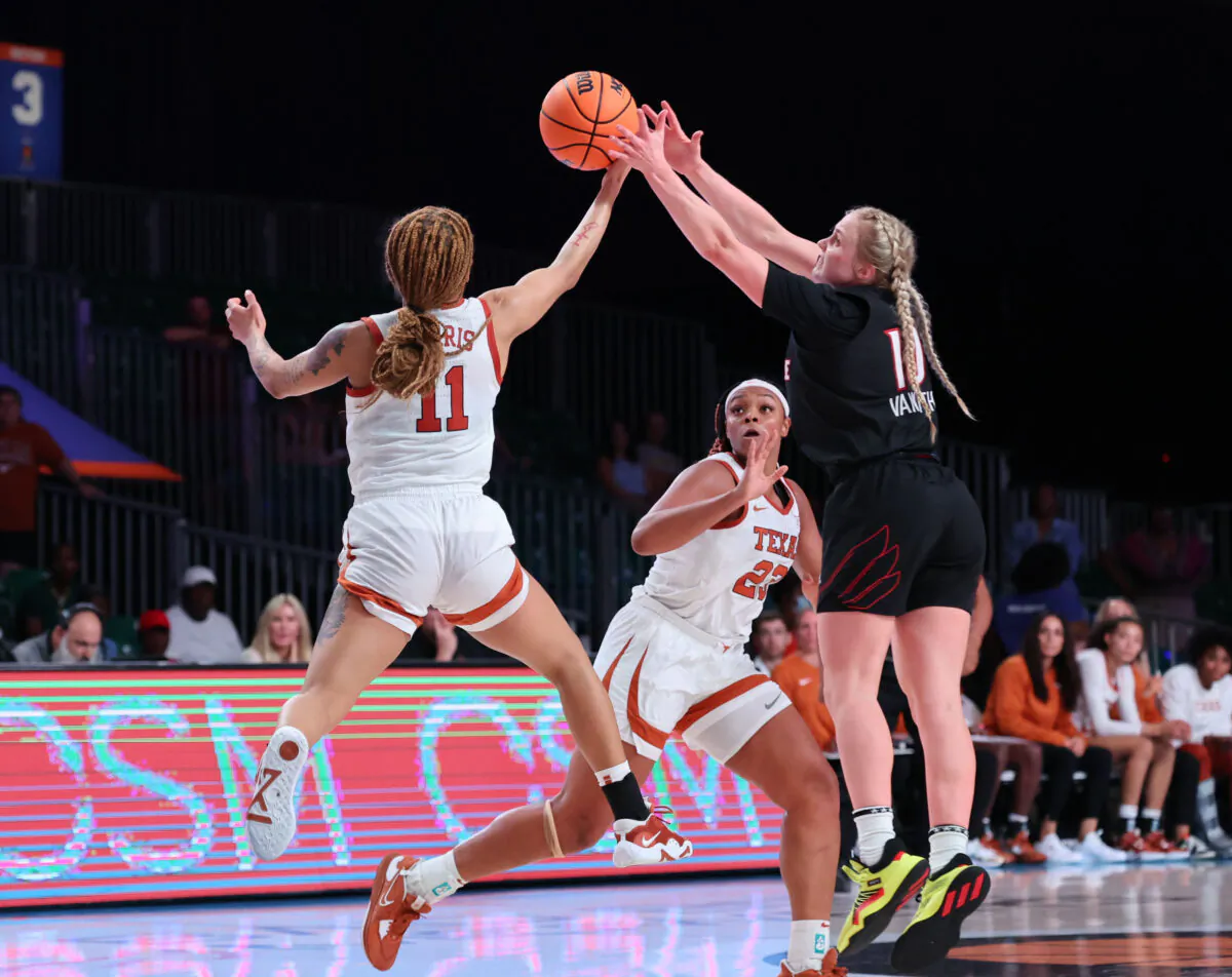 Texas' Sonya Morris (11) goes against Louisville's Hailey Van Lith (10) during an NCAA college basketball game in the Battle 4 Atlantis at Paradise Island, Bahamas, on Nov. 20, 2022. (Tim Aylen/Bahamas Visual Services via AP)