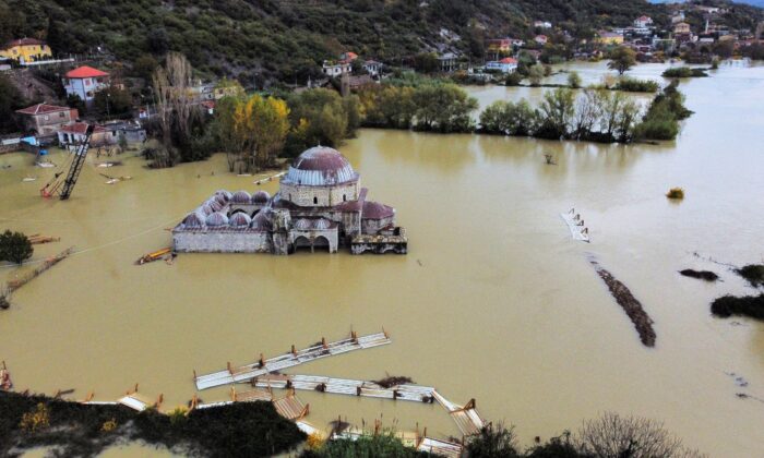 Floods surround the Reed Mosque after heavy rains in Shkodra, Albania, November 21, 2022.  (Florion Goga/Reuters)