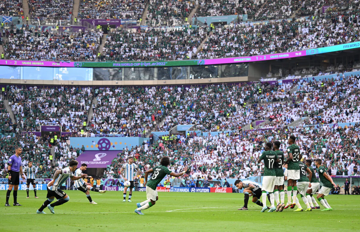 Lionel Messi of Argentina takes free kick during the FIFA World Cup Qatar 2022 Group C match between Argentina and Saudi Arabia at Lusail Stadium in Lusail City, Qatar, on Nov. 22, 2022. (Matthias Hangst/Getty Images)