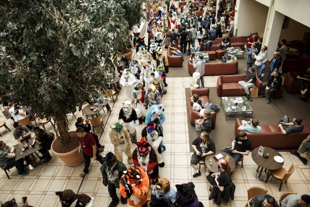 Furries walk in the Estrel hotel lobby after a march on the second day of the 2016 Eurofurence furry gathering on Aug. 18, 2016, in Berlin, Germany.  (Carsten Koall/Getty Images)