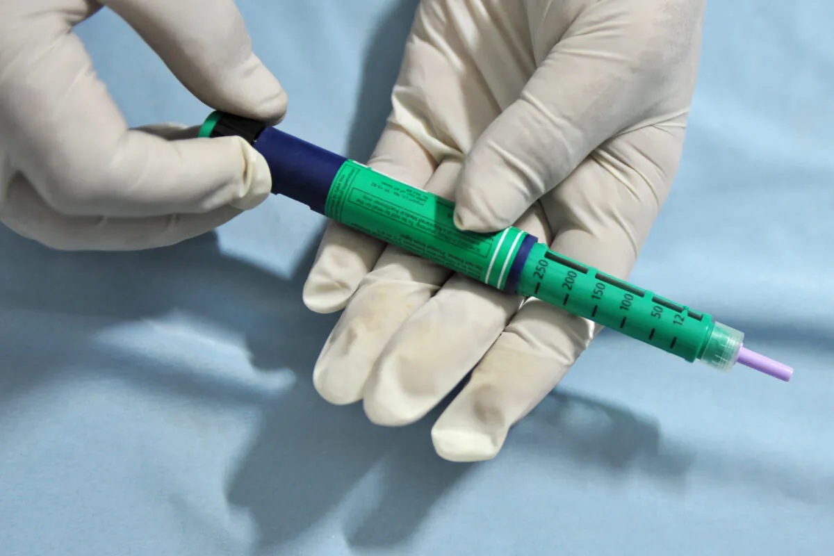 A medical assistant holds an insulin pen administered to diabetes patients at a private clinic in New Delhi on Nov. 8, 2011. (Sajjad Hussain/AFP via Getty Images)