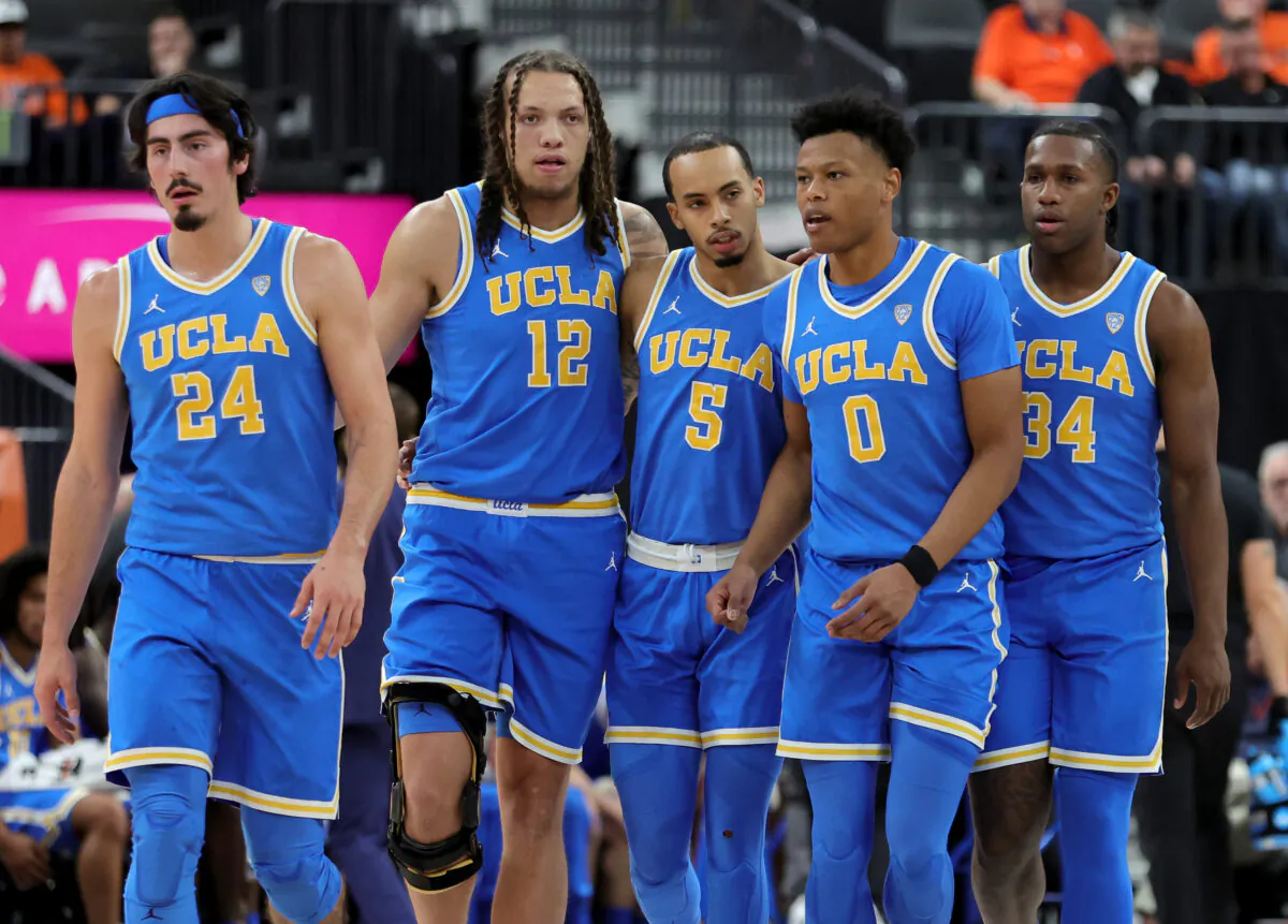 Jaime Jaquez Jr. (24), Mac Etienne (12), Amari Bailey (5), Jaylen Clark (0) and David Singleton (34) walk back onto the court after a timeout in the second half of their game against the Baylor Bears during the Continental Tire Main Event basketball tournament at T-Mobile Arena in Las Vegas, on Nov. 20, 2022. (Ethan Miller/Getty Images)