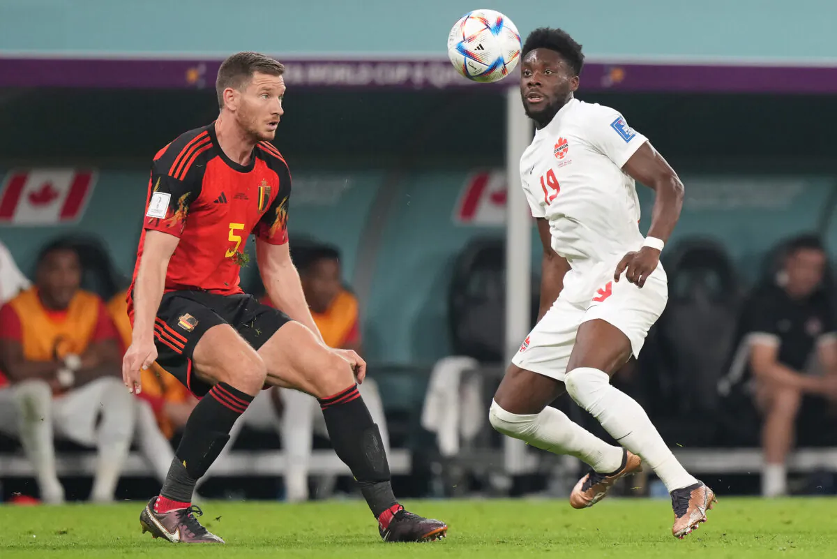 Canada forward Alphonso Davies (19) plays the ball in front of Belgium defender Jan Vertonghen (5) during second half Group F World Cup soccer action at Ahmad bin Ali Stadium in Al Rayyan, Qatar, on Nov. 23, 2022. (The Canadian Press/Nathan Denette)