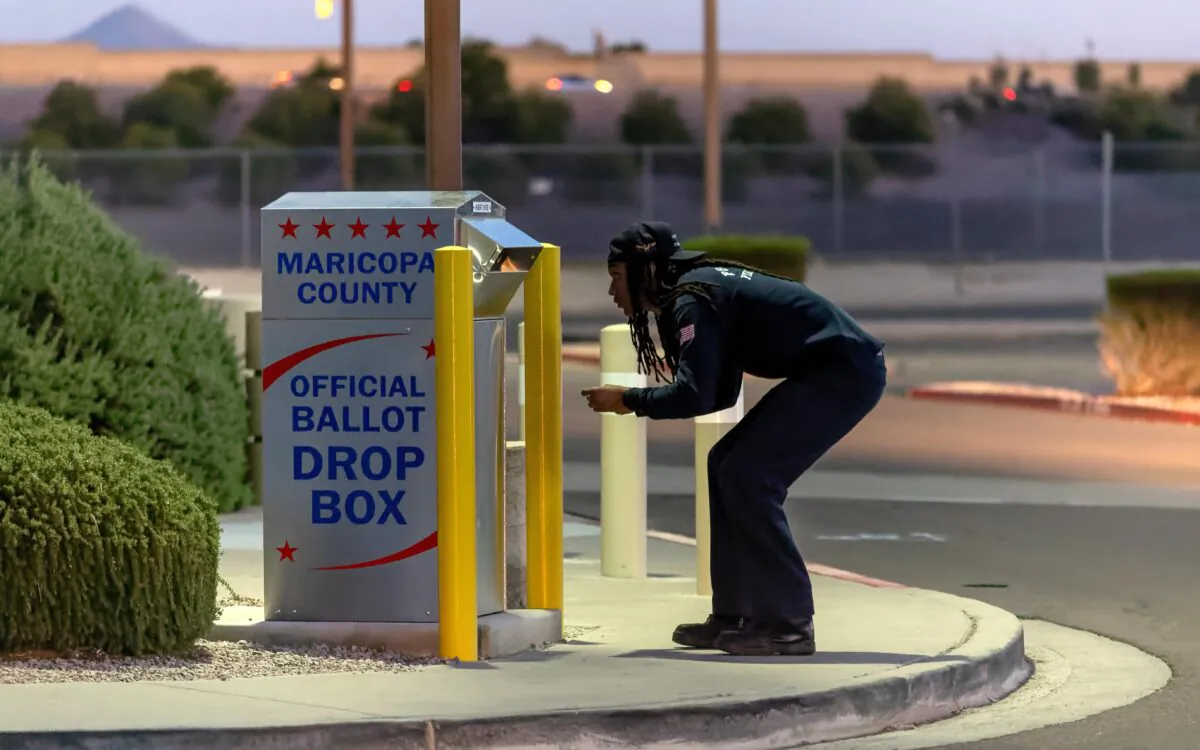 A voter casts his ballot at a drop box in Mesa, Ariz., on Nov. 8, 2022. (John Moore/Getty Images)