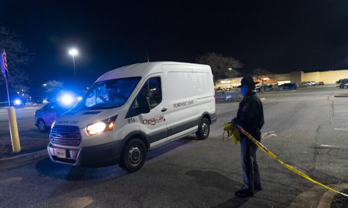 A forensics van leaves as law enforcement work at the scene of a mass shooting at a Walmart, on Nov. 23, 2022, in Chesapeake, Va. (AP Photo/Alex Brandon)