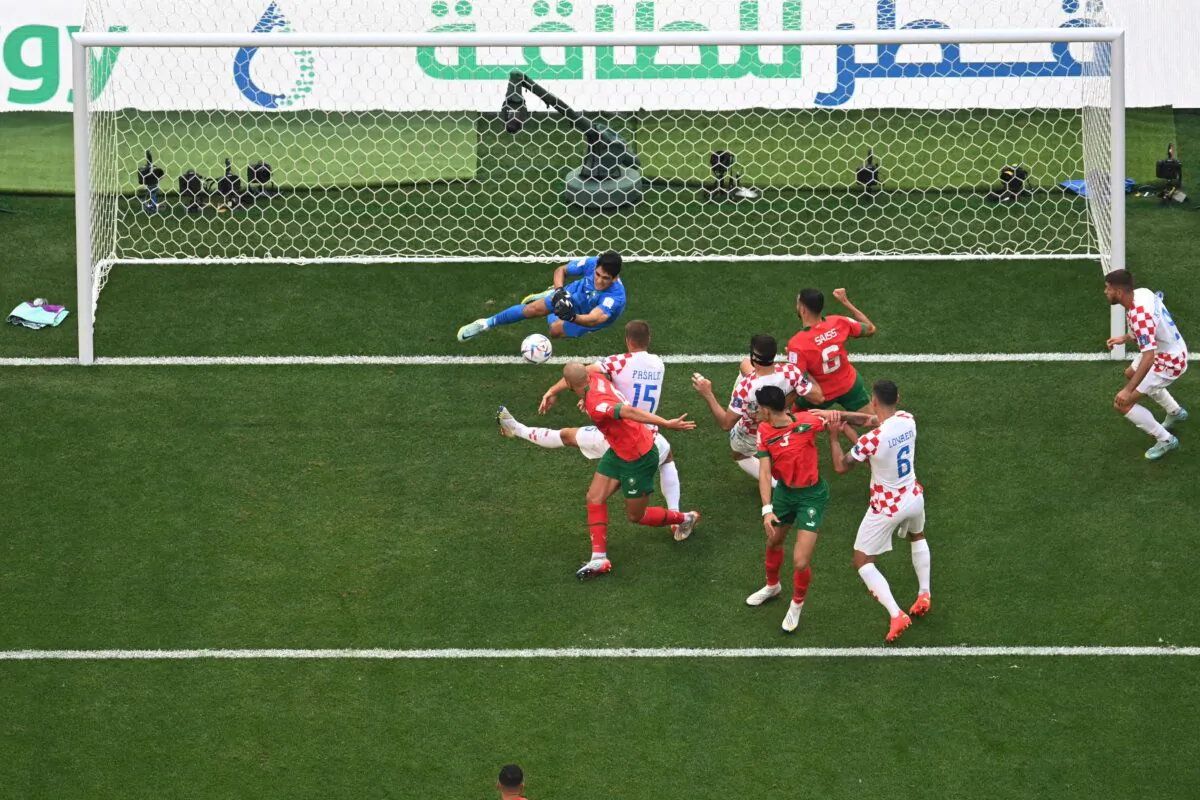Croatia's midfielder (15) Mario Pasalic (C) shoots the ball during the Qatar 2022 World Cup Group F football match between Morocco and Croatia at the Al-Bayt Stadium in Al Khor, north of Doha, Qatar, on Nov. 23, 2022. (Manan Vatsyayana/AFP via Getty Images)