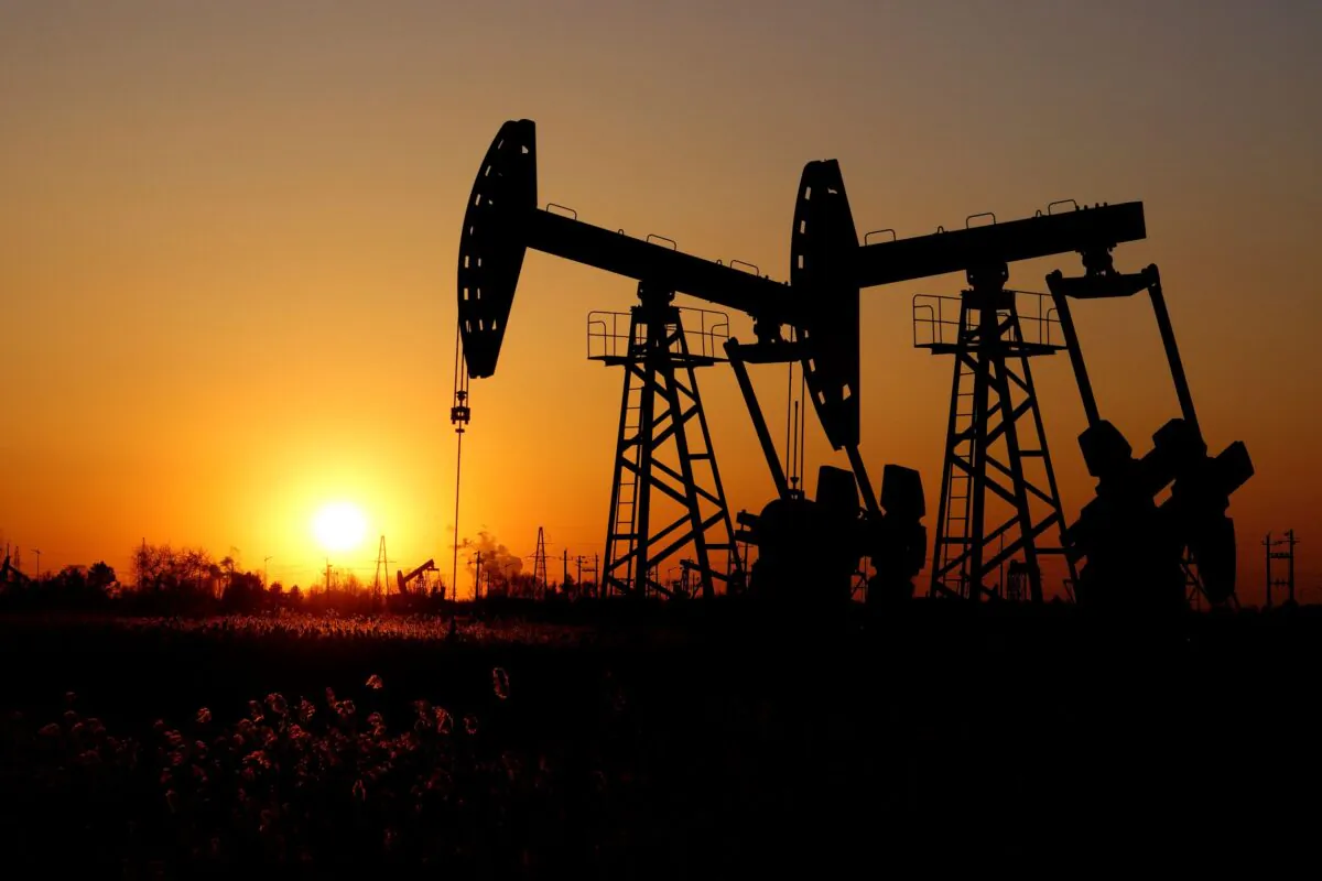 Pumpjacks are seen against the setting sun at the Daqing oil field in Heilongjiang Province, China, on Dec. 7, 2018. (Stringer/Reuters)