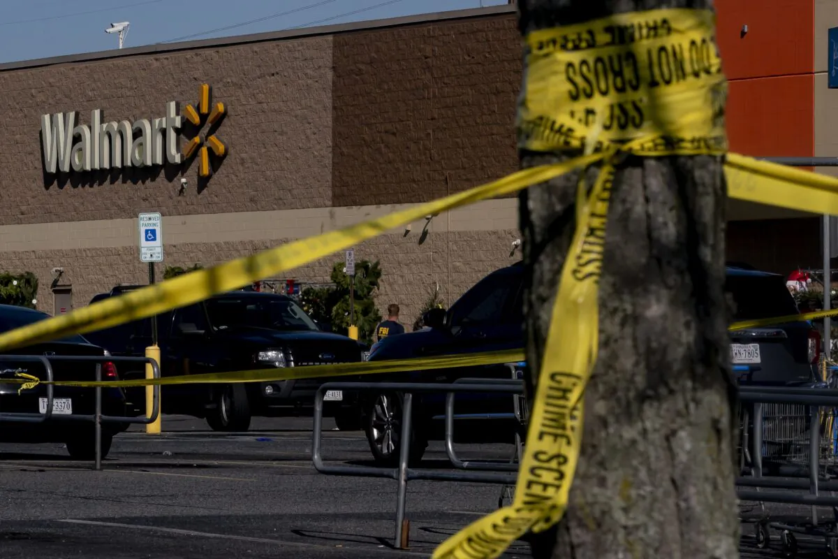 Members of the FBI and other law enforcement investigate the site of a fatal shooting in a Walmart in Chesapeake, Va., on Nov. 23, 2022. (Nathan Howard/Getty Images)