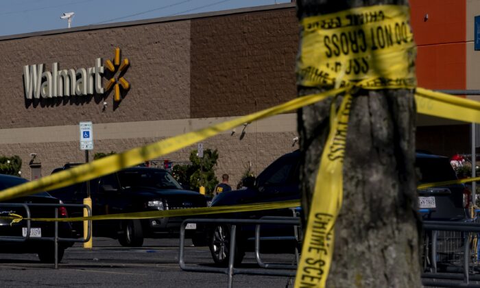 Members of the FBI and other law enforcement investigate the site of a fatal shooting in a Walmart in Chesapeake, Va., on Nov. 23, 2022. (Nathan Howard/Getty Images)