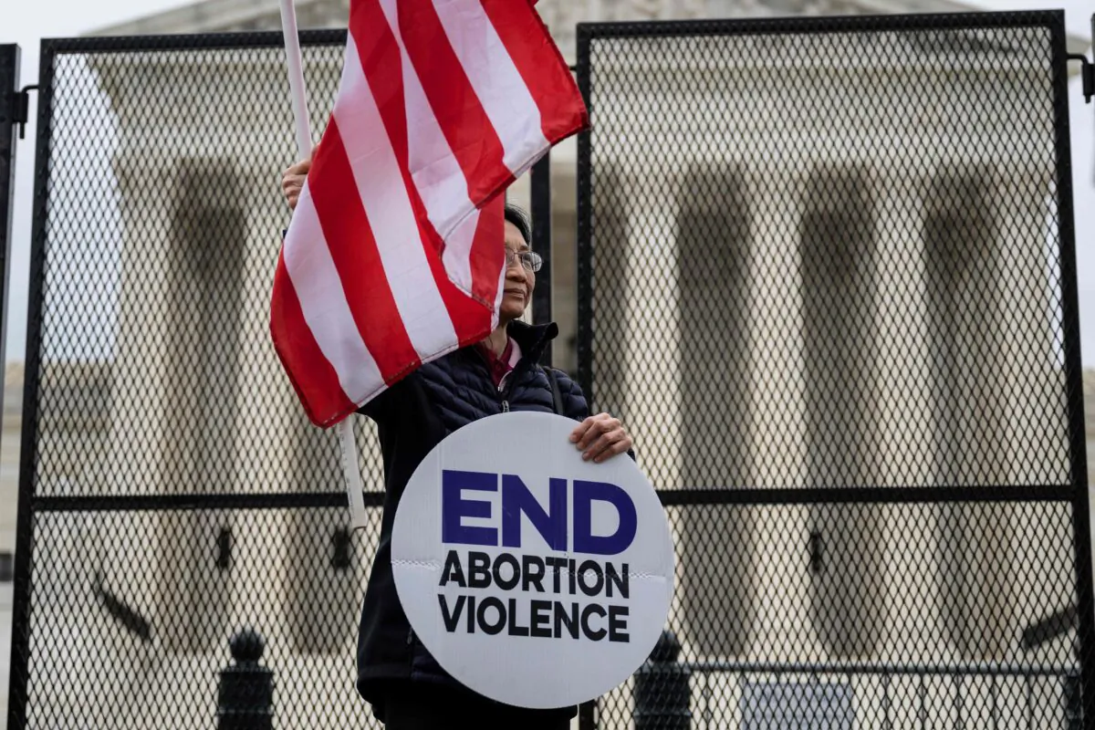 A pro-life demonstrator stands in front of the U.S. Supreme Court in Washington on May 5, 2022. (Jim Watson/AFP via Getty Images)