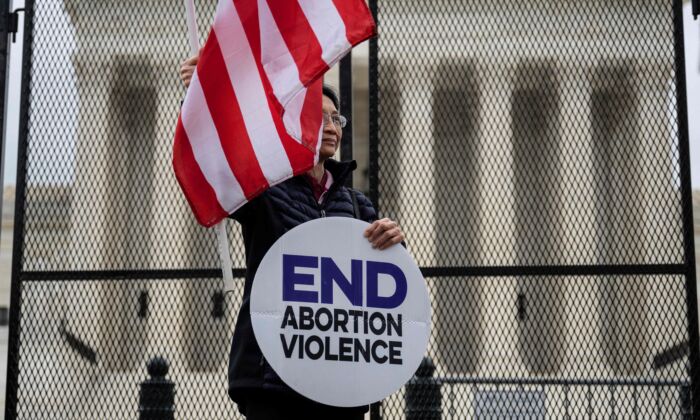 A pro-life demonstrator stands in front of the U.S. Supreme Court in Washington on May 5, 2022. (Jim Watson/AFP via Getty Images)