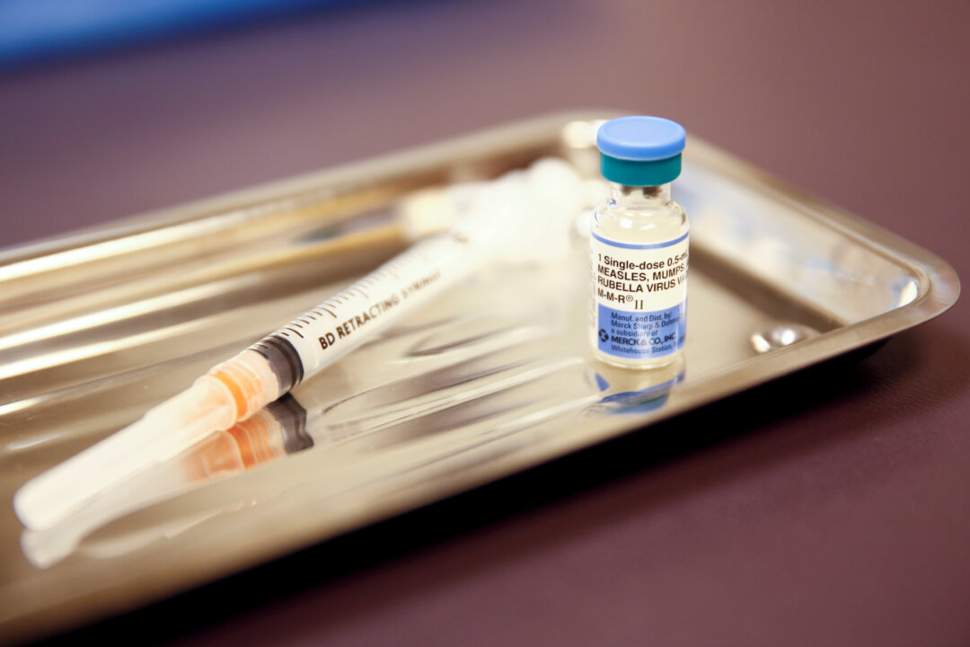 A vial of the measles, mumps, and rubella (MMR) vaccine at the International Community Health Services clinic in Seattle on March 20, 2019. (Lindsey Wasson/Reuters)