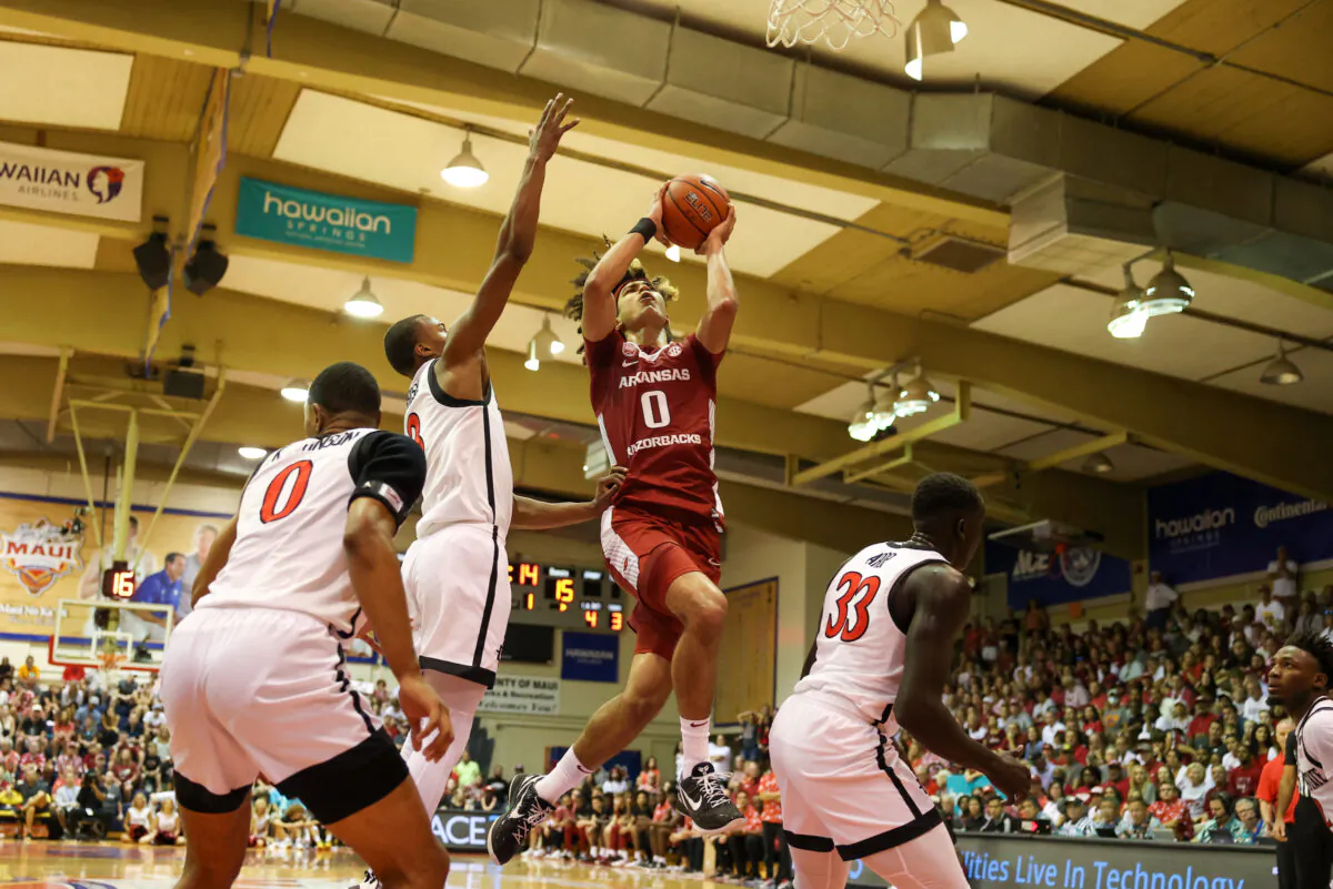 Anthony Black (0) of the Arkansas Razorbacks drives tot he basket before getting fouled by Micah Parrish (3) of the San Diego State Aztecs in the first half of the game during the Maui Invitational at Lahaina Civic Center in Lahaina, Hawaii, on Nov. 23, 2022. (Darryl Oumi/Getty Images)