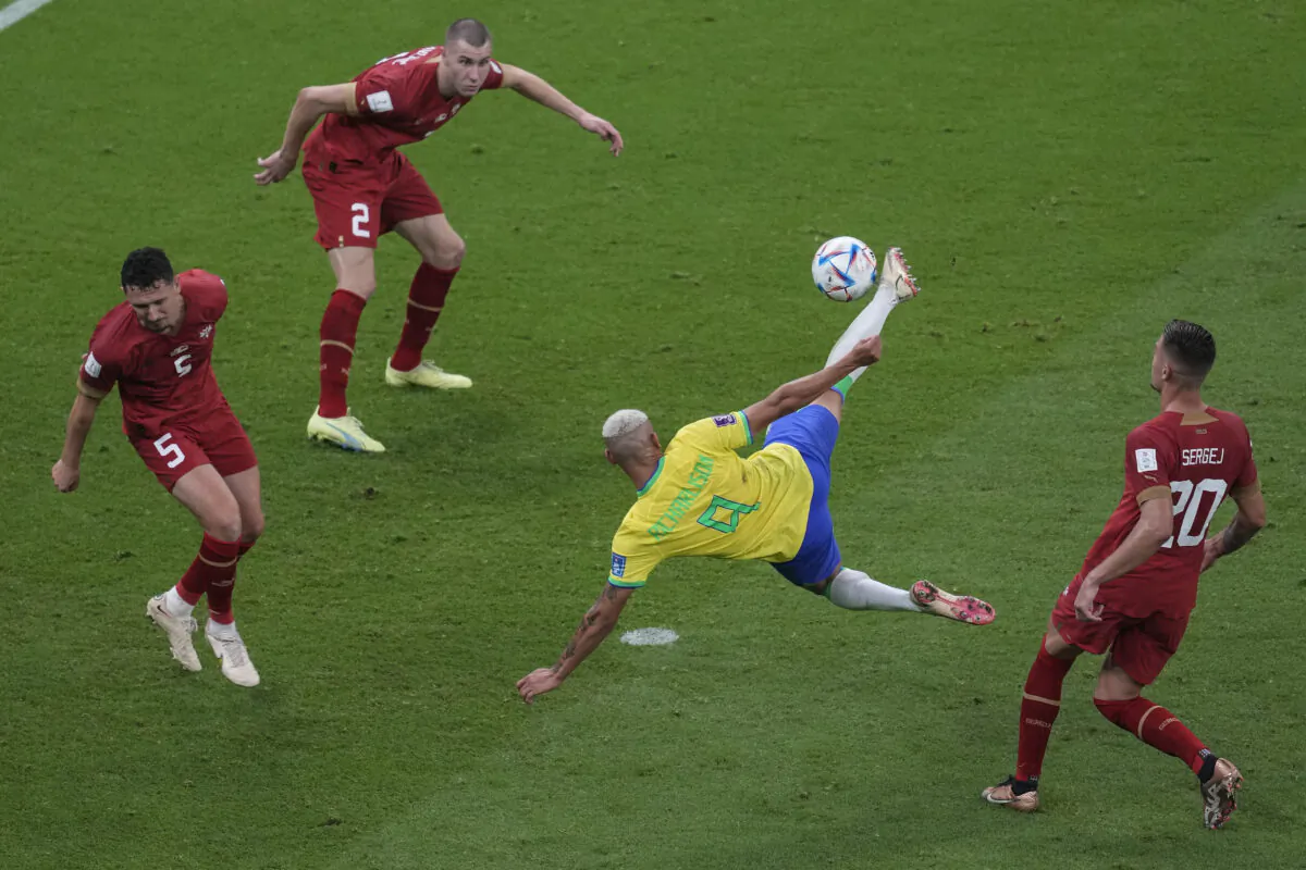 Brazil's Richarlison,second right, scores the second goal of his team against Serbia during the World Cup group G soccer match between Brazil and Serbia, at the the Lusail Stadium in Lusail, Qatar, on Nov. 24, 2022. (Darko Vojinovic/AP Photo)