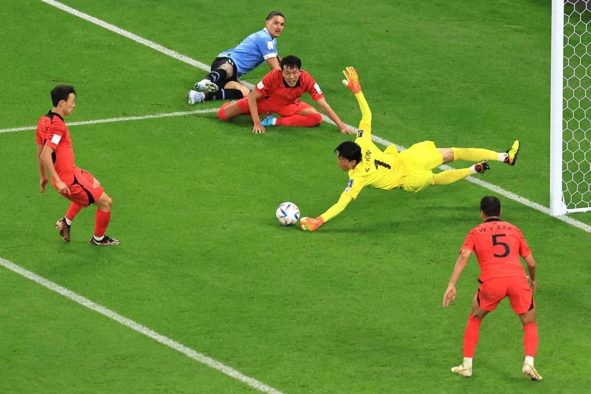 Seunggyu Kim of Korea Republic makes a save against an attempt by Darwin Nunez of Uruguay during the FIFA World Cup Qatar 2022 Group H match between Uruguay and Korea Republic at Education City Stadium on November 24, 2022 in Al Rayyan, Qatar. (Photo by Buda Mendes/Getty Images)