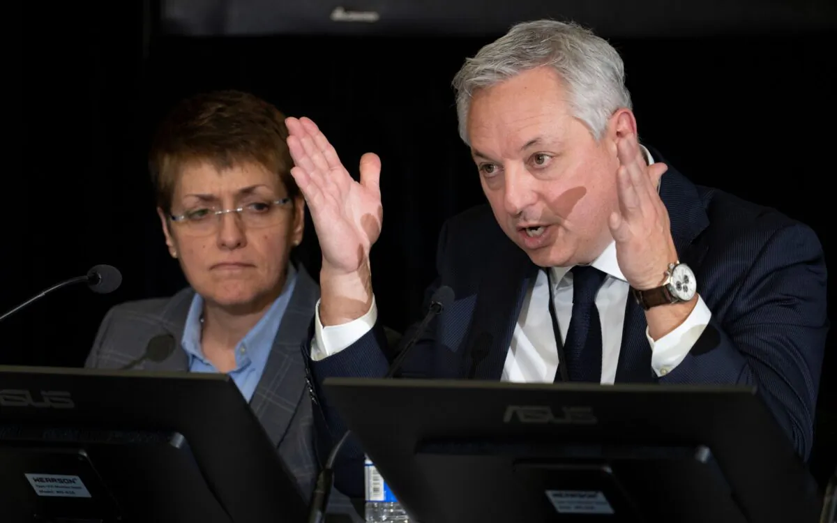 Canadian Security Intelligence Service Director David Vigneault responds to a question as Deputy Director of Operations Michelle Tessier looks on, during testimony at the Public Order Emergency Commission in Ottawa on Nov. 21, 2022. (The Canadian Press/Adrian Wyld)