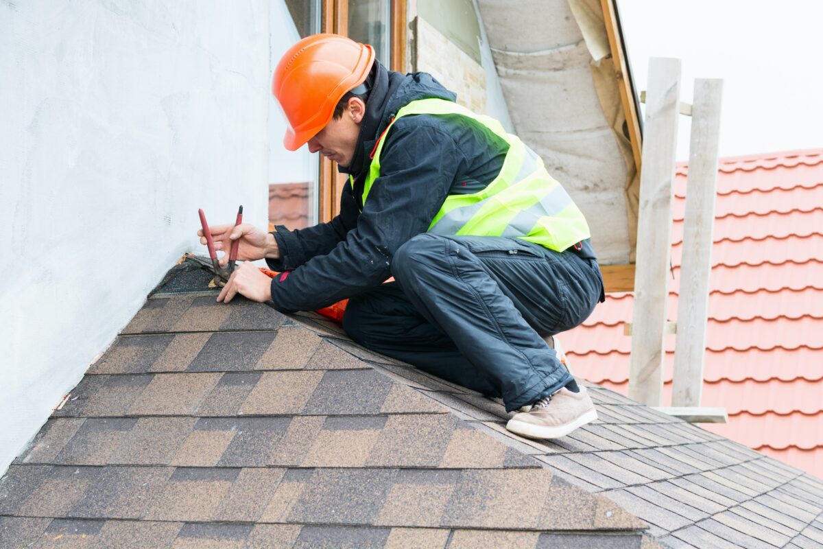 If you have a leak, it's a good idea to hire a contractor to check the roof and make any needed repairs. (Olha Hrokhovetska/Shutterstock)