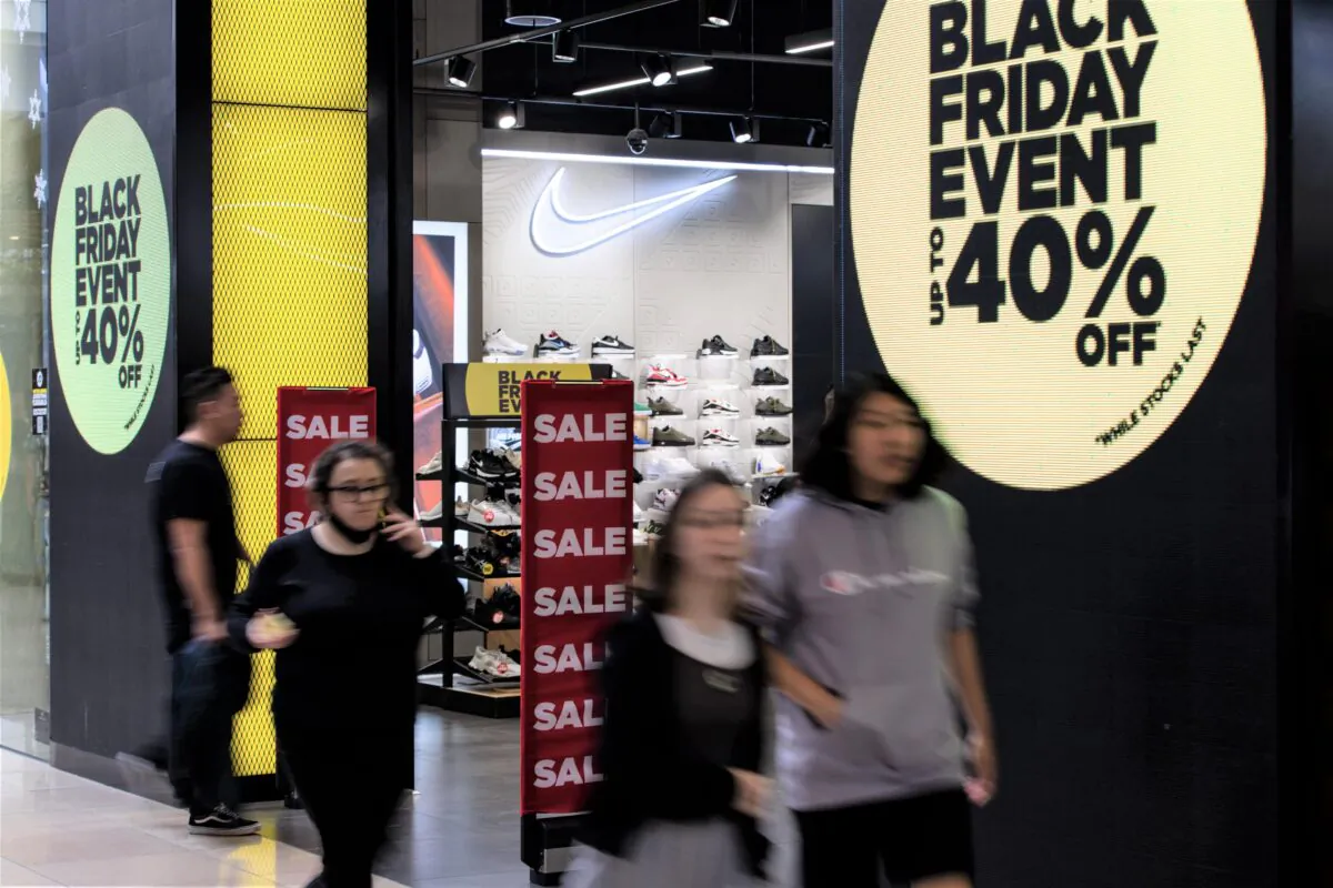 Sale signs are seen outside shops during Black Friday sales at Chadstone Shopping Centre in Melbourne, Australia, on Nov. 25, 2022. (AAP Image/Diego Fedele) 