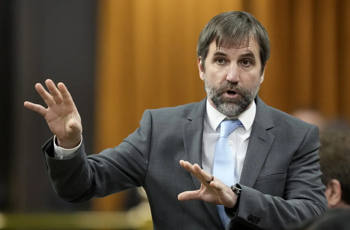 Minister of Environment and Climate Change Steven Guilbeault rises during Question Period in Ottawa on Nov. 22, 2022. (Adrian Wyld/The Canadian Press)