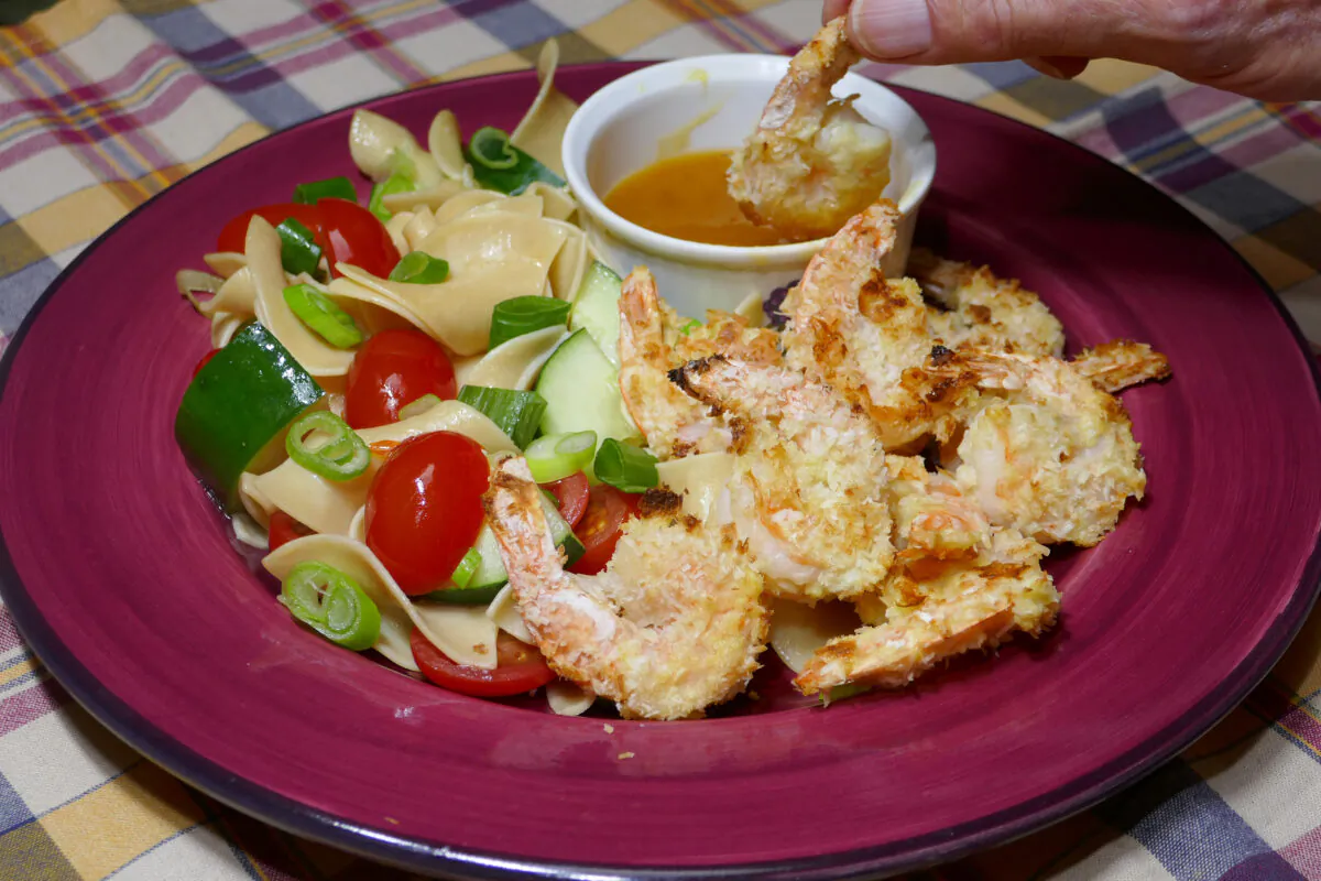 Coconut-Crusted Shrimp with Sesame Noodles. (Linda Gassenheimer/TNS)
