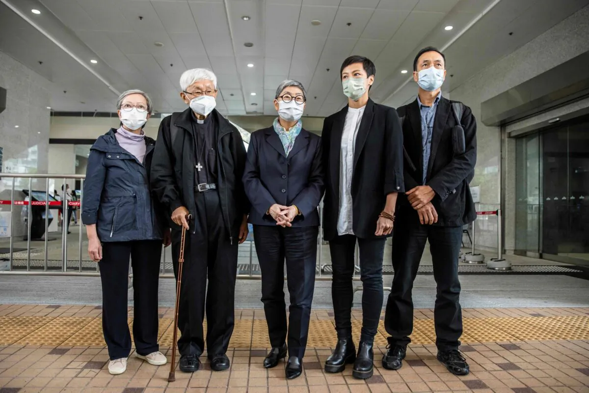 (L–R) Former lawmaker Cyd Ho, Cardinal Joseph Zen, human rights barrister Margaret Ng, activist and singer Denise Ho, and professor Hui Po-keung pose for a photo outside West Kowloon Court in Hong Kong on Nov. 25, 2022. (Isaac Lawrence/AFP via Getty Images)