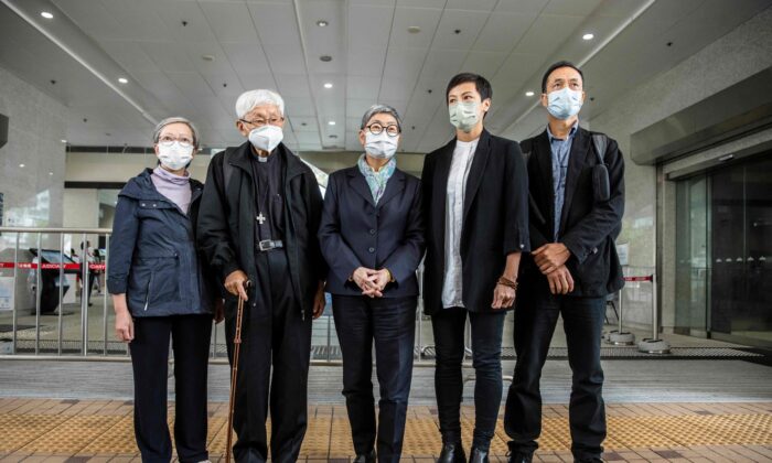 (L–R) Former lawmaker Cyd Ho, Cardinal Joseph Zen, human rights barrister Margaret Ng, activist and singer Denise Ho, and professor Hui Po-keung pose for a photo outside West Kowloon Court in Hong Kong on Nov. 25, 2022. (Isaac Lawrence/AFP via Getty Images)