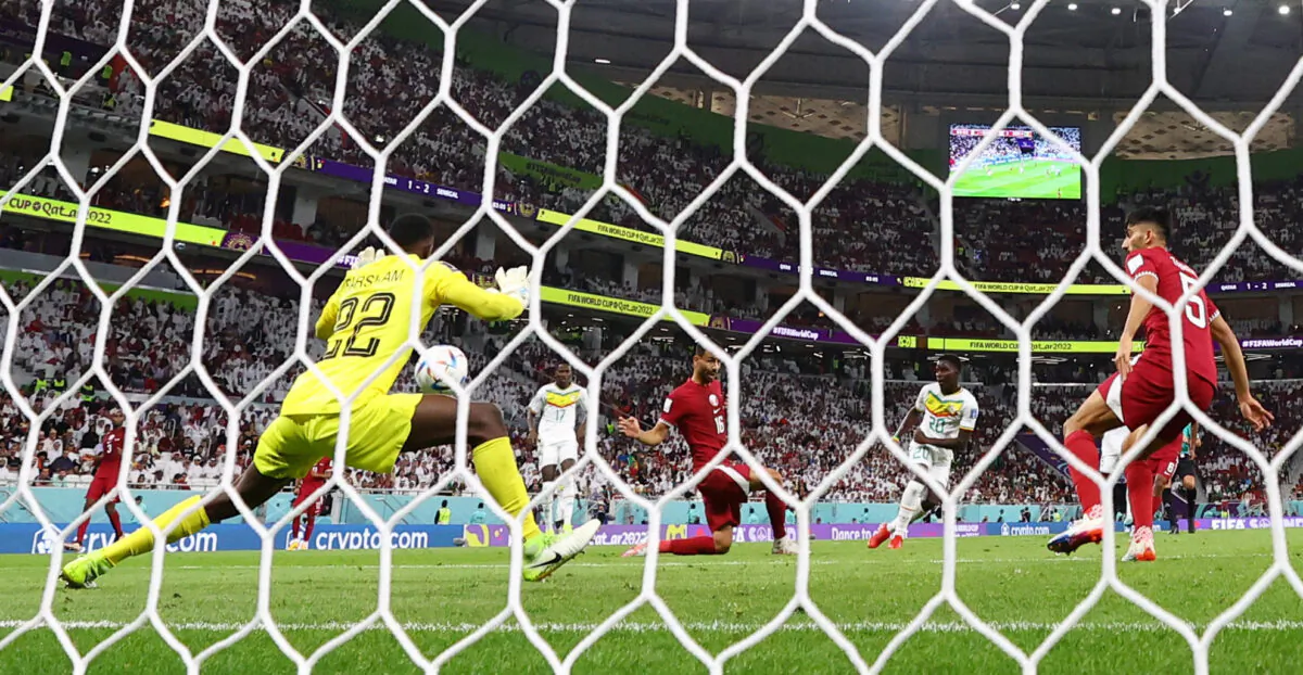 Senegal's Bamba Dieng scores their third goal  during the FIFA World Cup Qatar 2022 Group A match between 
Qatar and Senegal at Al Thumama Stadium, in Doha, Qatar, on Nov. 25, 2022. (Kai Pfaffenbach/Reuters)