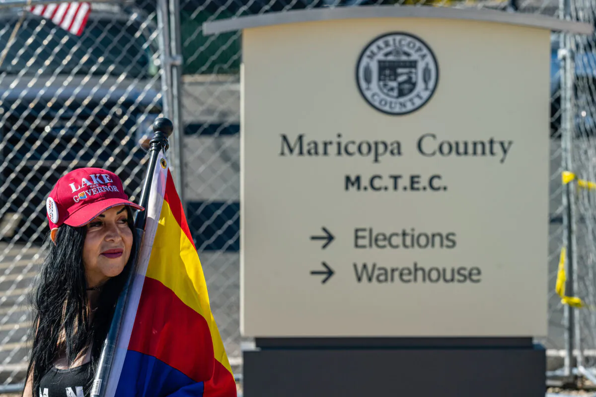 An activist wearing a 'Lake for Governor' hat protests the election process in front of the Maricopa County Tabulation and Election Center in Phoenix, Arizona, on Nov. 14, 2022. (Jon Cherry/Getty Images)