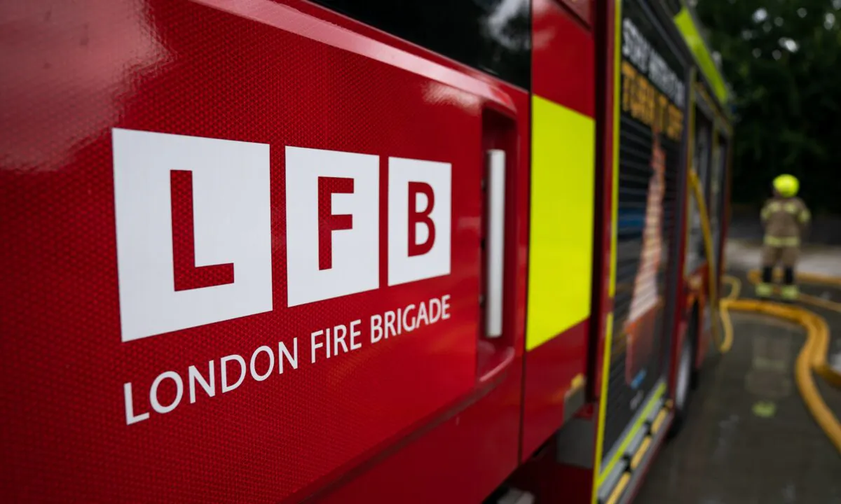 London Fire Brigade logo from the side of a fire engine at a fire station in East London, on July 21, 2022. (Aaron Chown/PA Media)