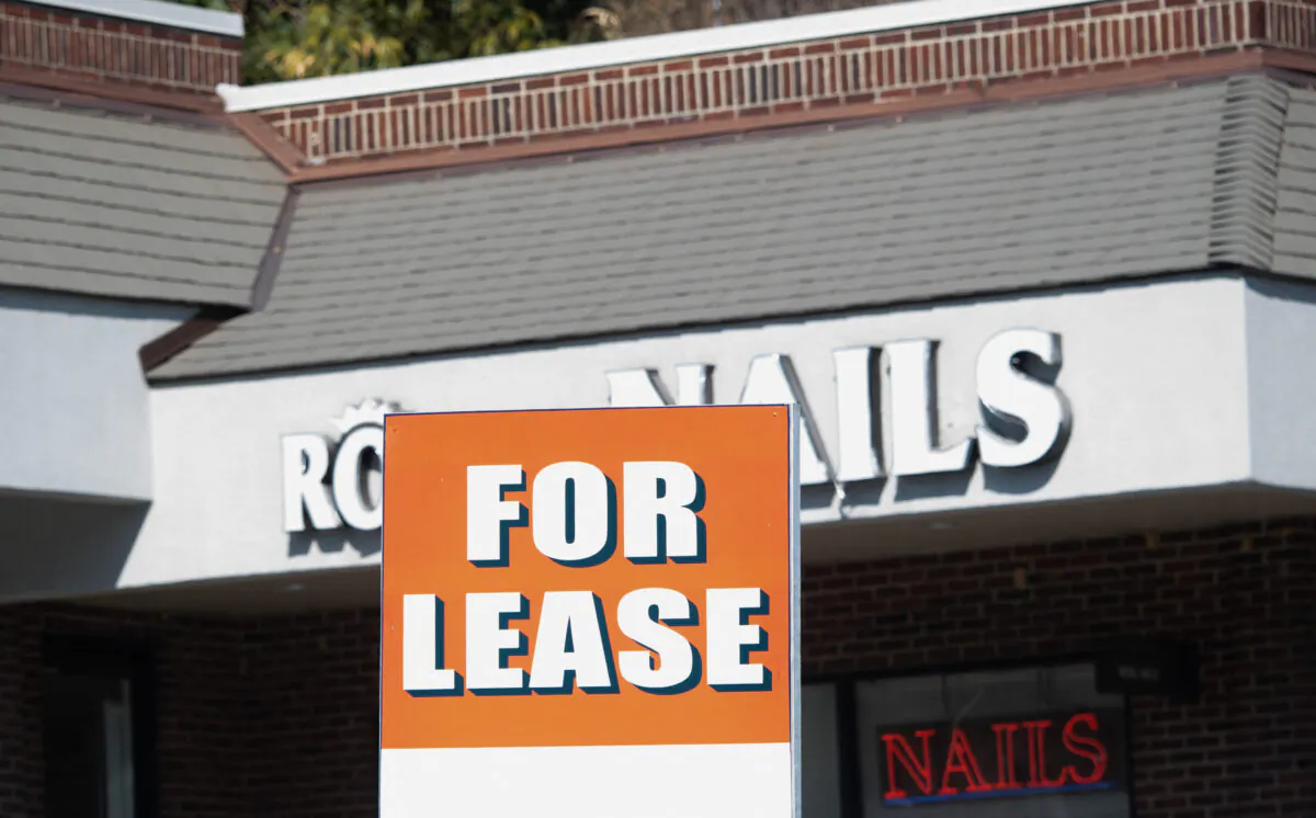 A sign advertises commercial real estate for lease at a strip mall in Arlington, Va., on Feb. 15, 2022. (Saul Loeb/AFP via Getty Images)