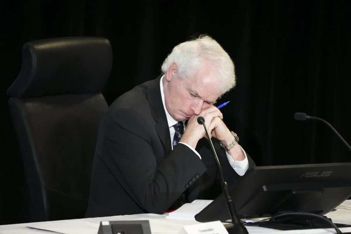 Commissioner Paul Rouleau rests on his hands as Prime Minister Justin Trudeau appears as a witnesses at the Public Order Emergency Commission in Ottawa, on Nov. 25, 2022. (The Canadian Press/Sean Kilpatrick)
