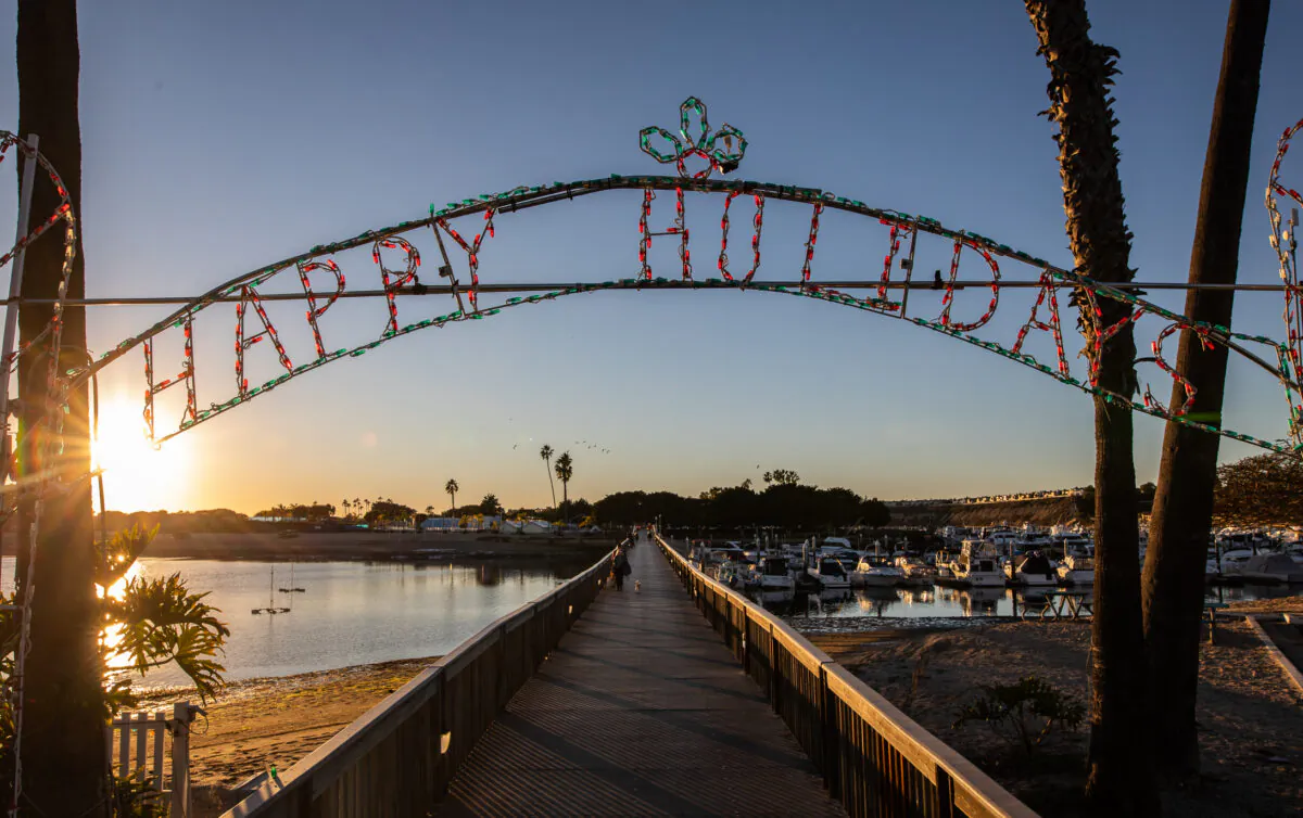 People participate in the 53 annual "Lighting of the Bay" at The Newport Dunes Resort in Newport Beach, Calif., on Nov. 25, 2022. (John Fredricks/The Epoch Times)