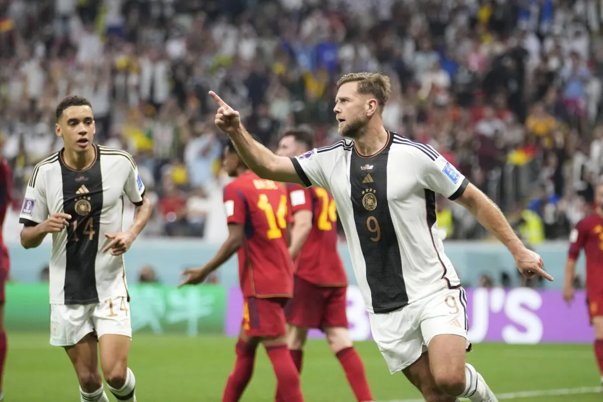 Germany's Niclas Fuellkrug celebrates after he scored his side's first goal during the World Cup group E soccer match between Spain and Germany, at the Al Bayt Stadium in Al Khor, Qatar, on Nov. 27, 2022. (Luca Bruno/AP Photo)