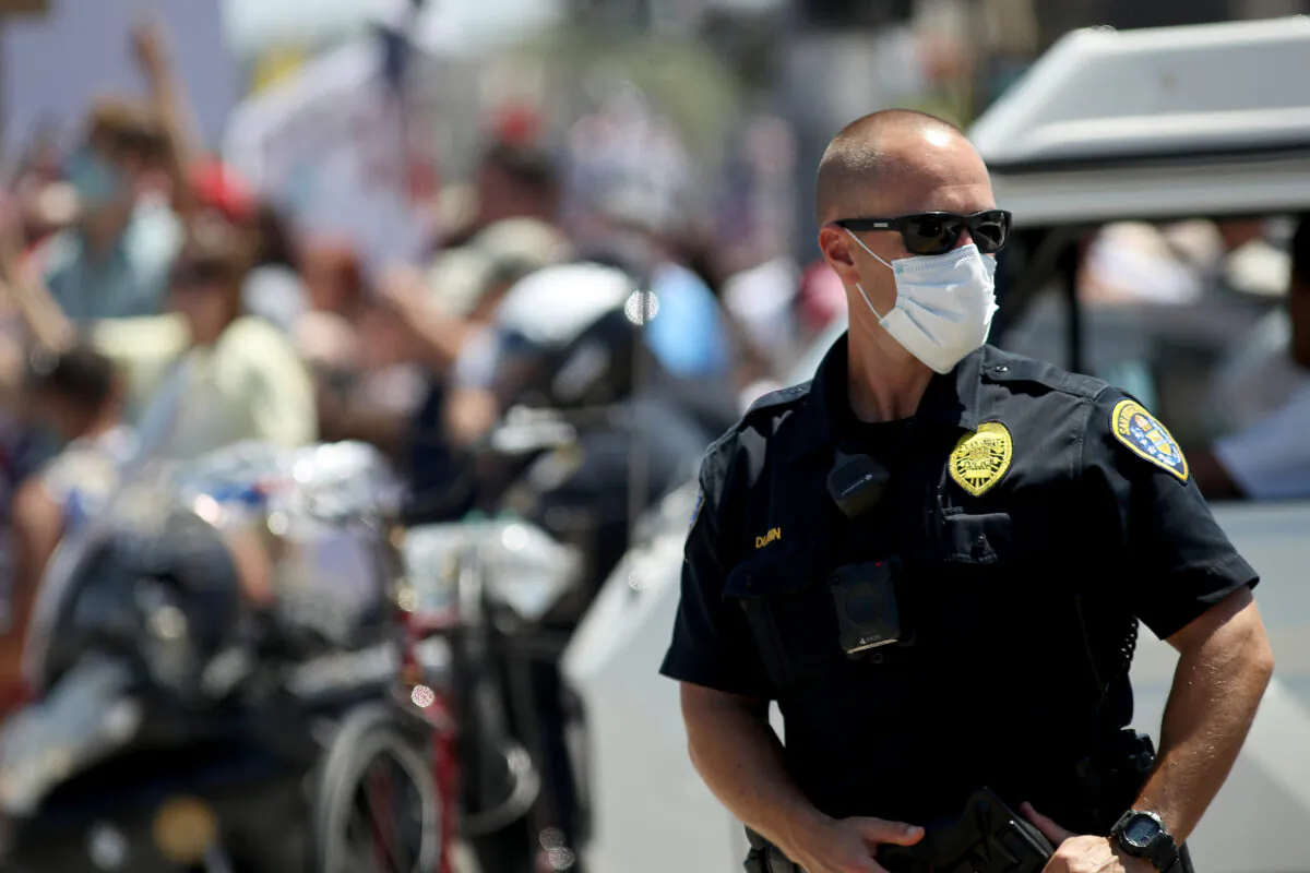 A San Diego Police Department officer looks on during a protest in San Diego on April 26, 2020. (Sean M. Haffey/Getty Images)