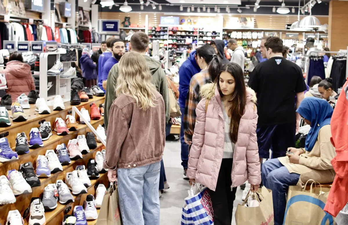 A woman carries shopping bags as customers visit the American Mall dream mall during Black Friday in East Rutherford, New Jersey, on Nov. 25, 2022. (Kena Betancur/Getty Images)