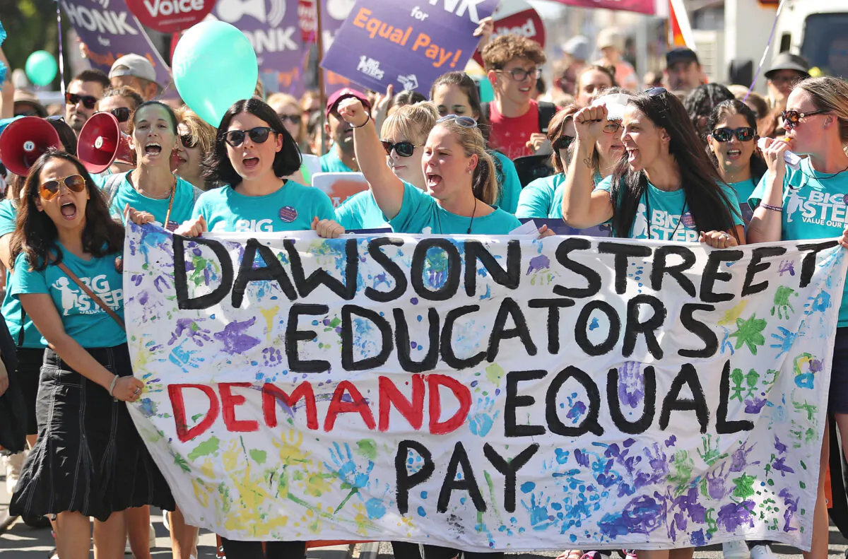Childcare workers and supporters from Dawson Street Child Care Co-operative walk down Sydney Road during a protest march as part of a campaign in Melbourne, Australia, for higher wages on March 8, 2017. (Scott Barbour/Getty Images)