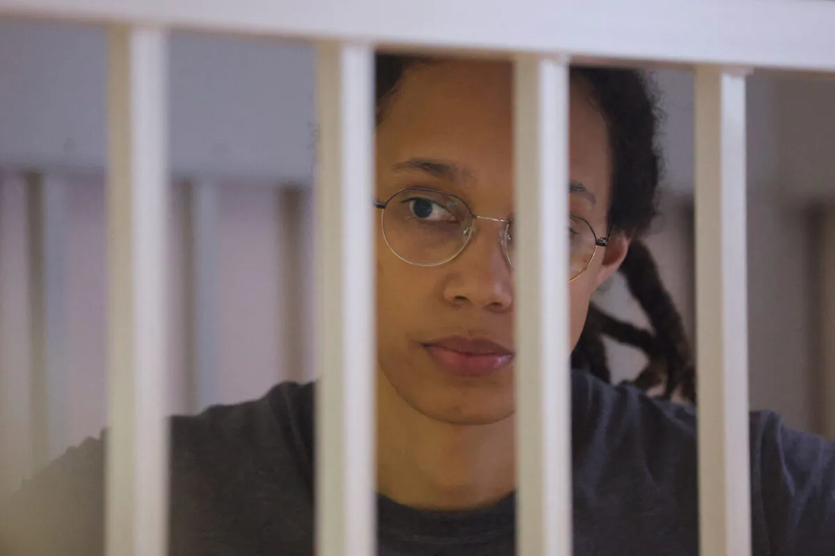 U.S. basketball player Brittney Griner stands inside a defendants' cage during the reading of the court's verdict in Khimki, Russia, outside Moscow, on Aug. 4, 2022. (Evgenia Novozhenina/Pool/Reuters)