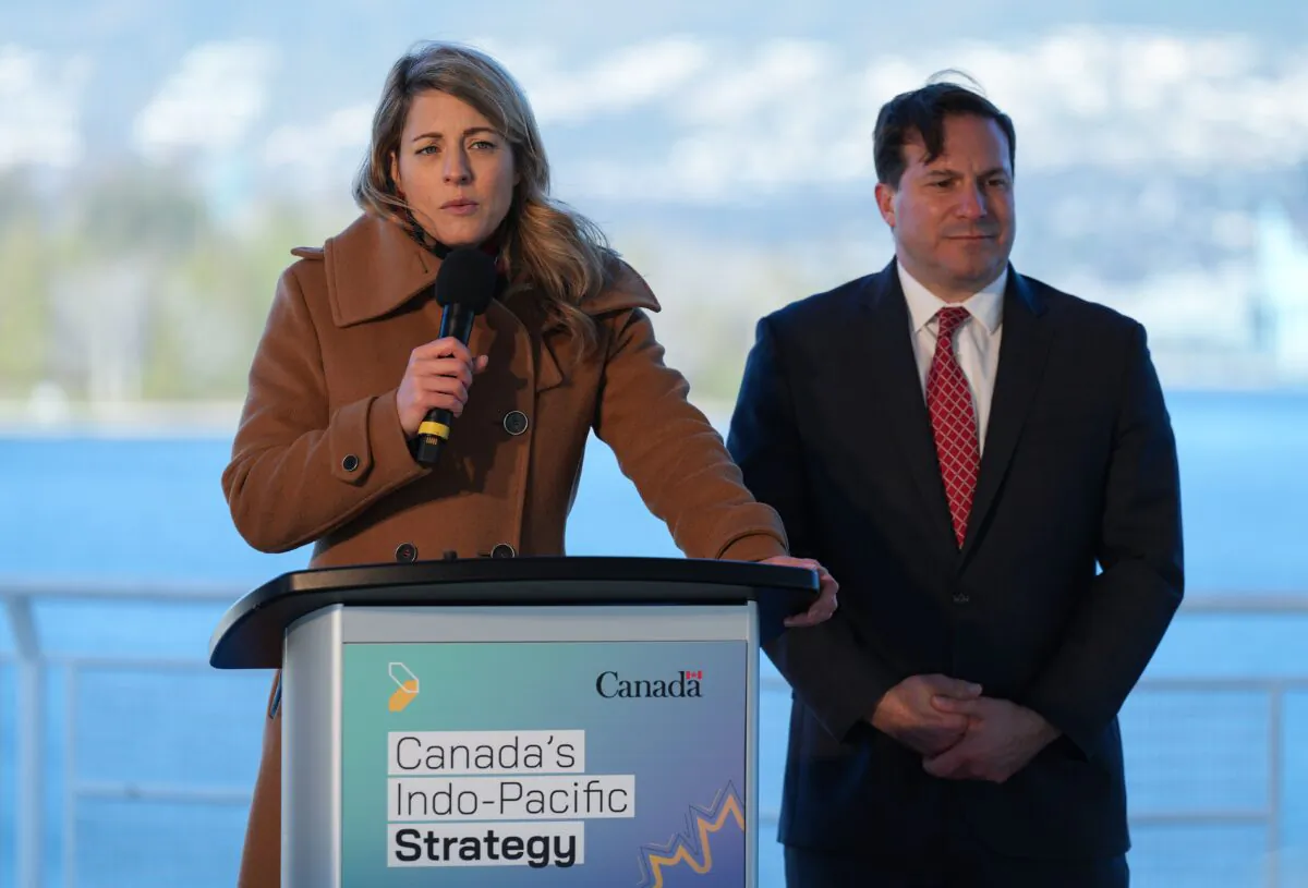 Foreign Affairs Minister Melanie Joly responds to questions as Public Safety Minister Marco Mendocino listens during a news conference to announce Canada's Indo-Pacific strategy in Vancouver on Nov. 27, 2022. (The Canadian Press/Darryl Dyck)