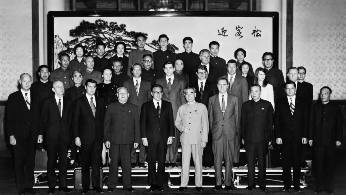 U.S. President Richard Nixon's special adviser, Henry Kissinger (5 CL), and Chinese Premier Zhou Enlai (6 CL) pose with their delegations for a group photo in Beijing on Oct. 22, 1971. Kissinger travelled to China to meet with Zhou to set the stage for Nixon's historic visit in 1972. (AFP via Getty Images)
