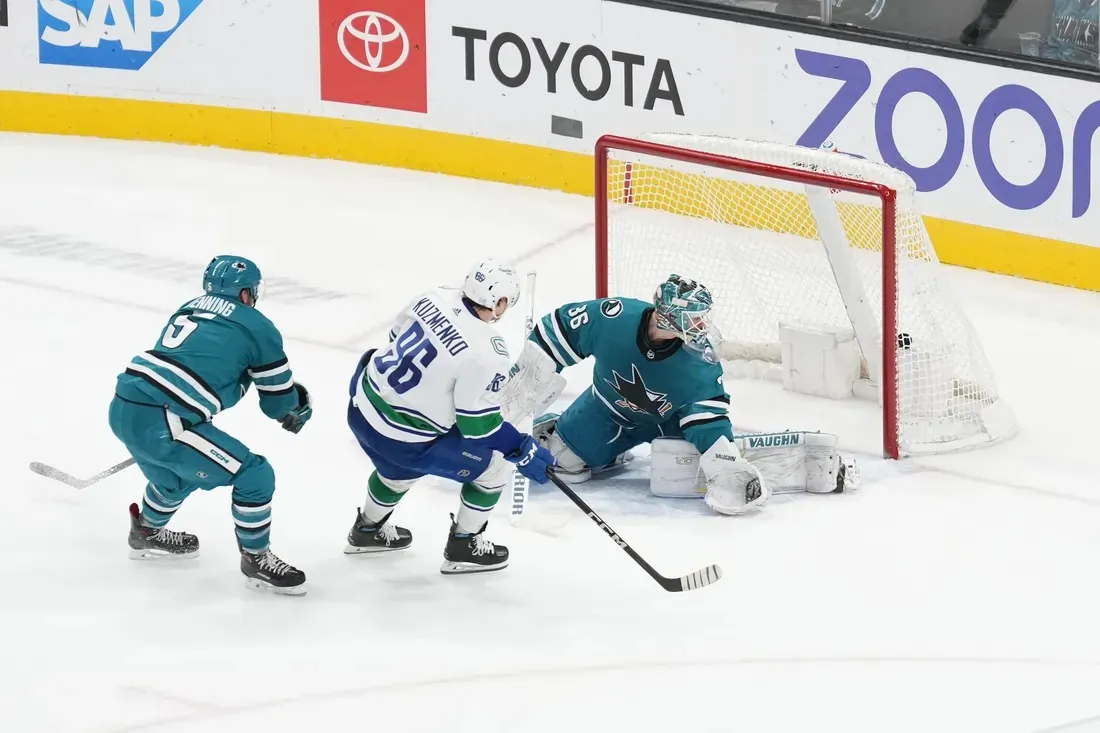 Vancouver Canucks left wing Andrei Kuzmenko (96) scores against San Jose Sharks goaltender Kaapo Kahkonen (36) and defenseman Matt Benning (5) during overtime at SAP Center at San Jose, Calif., on Nov. 27, 2022. (Darren Yamashita-USA TODAY Sports via Field Level Media)