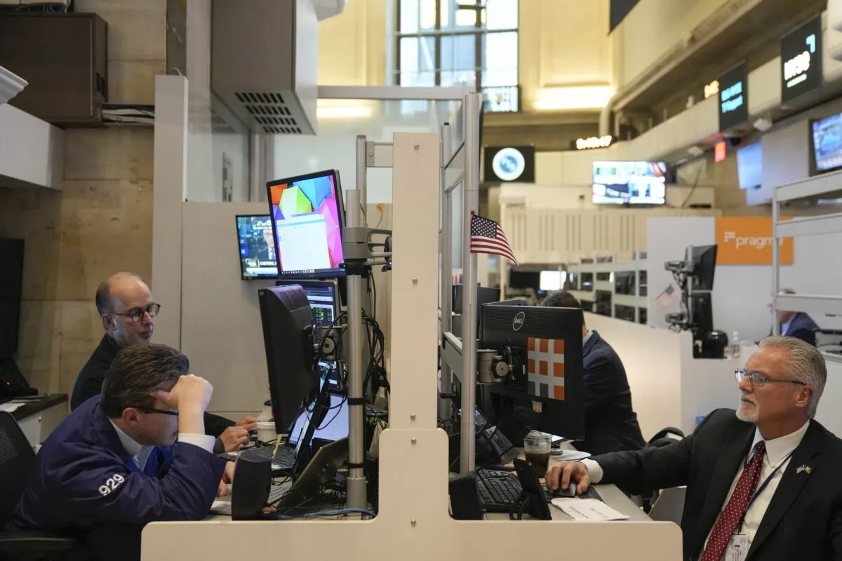 Traders work on the floor at the New York Stock Exchange in New York on Nov. 28, 2022. (Seth Wenig/AP Photo)