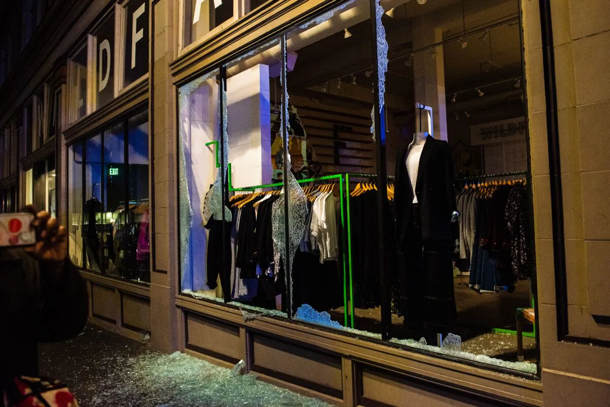 A clothing store is vandalized during a demonstration called by "Black Lives Matter" in Portland, Oregon, on Nov. 4, 2020. (Kathryn Elsesser/AFP via Getty Images)